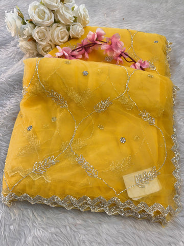 Net saree with floral sequin embroidery, leaf vine motifs, and zigzag border work β includes unstitched blouse