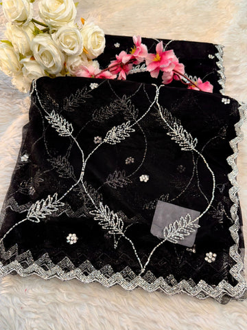 Net saree with floral sequin embroidery, leaf vine motifs, and zigzag border work β includes unstitched blouse