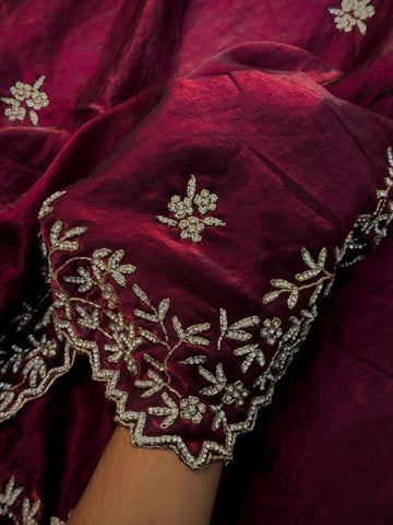 Fendy silk saree with stone floral embroidery and scalloped border in wine and rani pink color