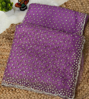 Glass tissue saree with intricate silver samosa handwork and scalloped sequin border, available in elegant pastel and jewel-tone shades