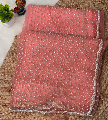 Glass tissue saree with intricate silver samosa handwork and scalloped sequin border, available in elegant pastel and jewel-tone shades