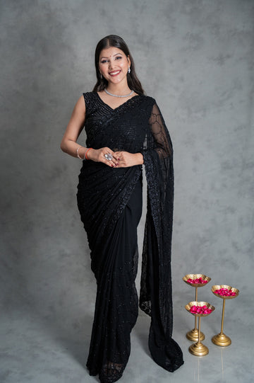Black georgette saree with all-over cutdana embroidery β folded view