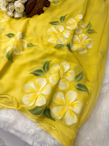 Hand-painted chiffon saree with large floral motifs in pastel shades – lightweight, flowy, and elegant.

