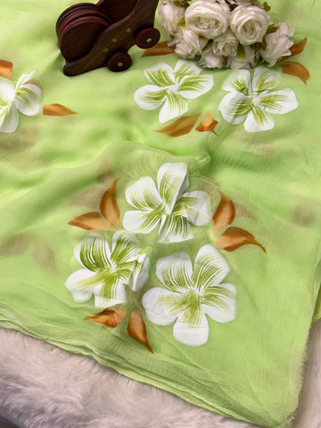 Hand-painted chiffon saree with large floral motifs in pastel shades – lightweight, flowy, and elegant.

