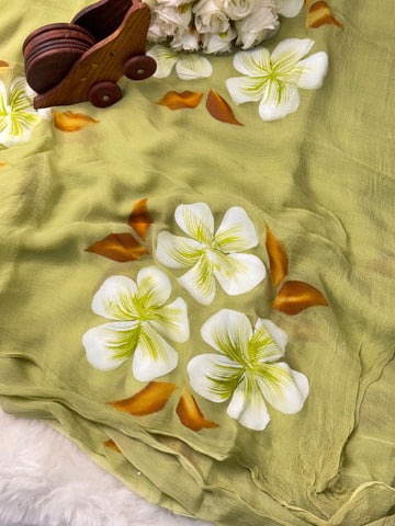 Hand-painted chiffon saree with large floral motifs in pastel shades – lightweight, flowy, and elegant.

