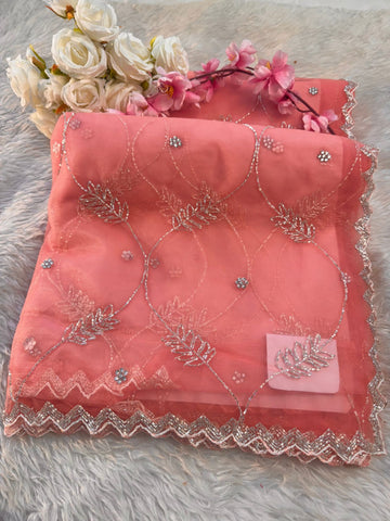 Net saree with floral sequin embroidery, leaf vine motifs, and zigzag border work – includes unstitched blouse