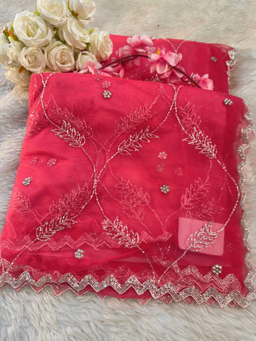 Net saree with floral sequin embroidery, leaf vine motifs, and zigzag border work – includes unstitched blouse
