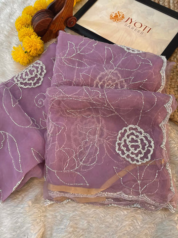 Glass tissue saree with floral embroidery in cutdana and pearl work, scalloped border, and unstitched blouse piece – by Jyoti Sarees