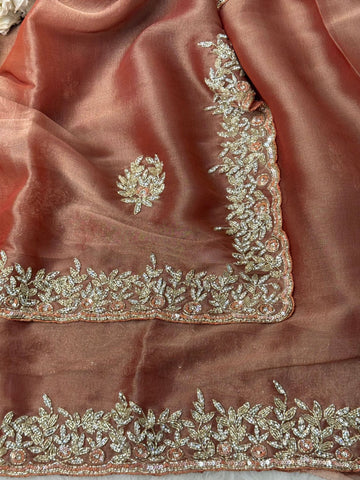 
Indian Lady Tissue saree with heavy cutdana handwork, sequin floral motifs, and scalloped embroidered border