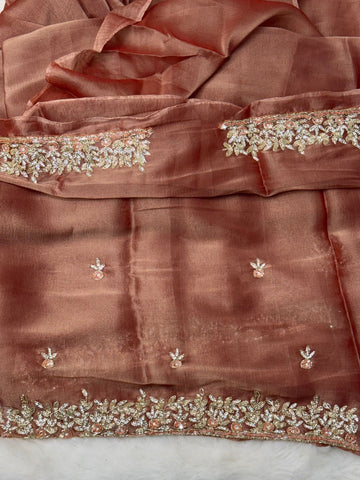 
Indian Lady Tissue saree with heavy cutdana handwork, sequin floral motifs, and scalloped embroidered border