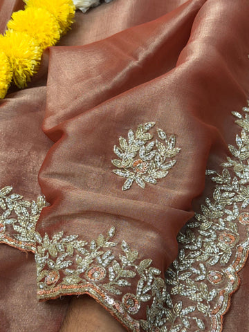 
Indian Lady Tissue saree with heavy cutdana handwork, sequin floral motifs, and scalloped embroidered border