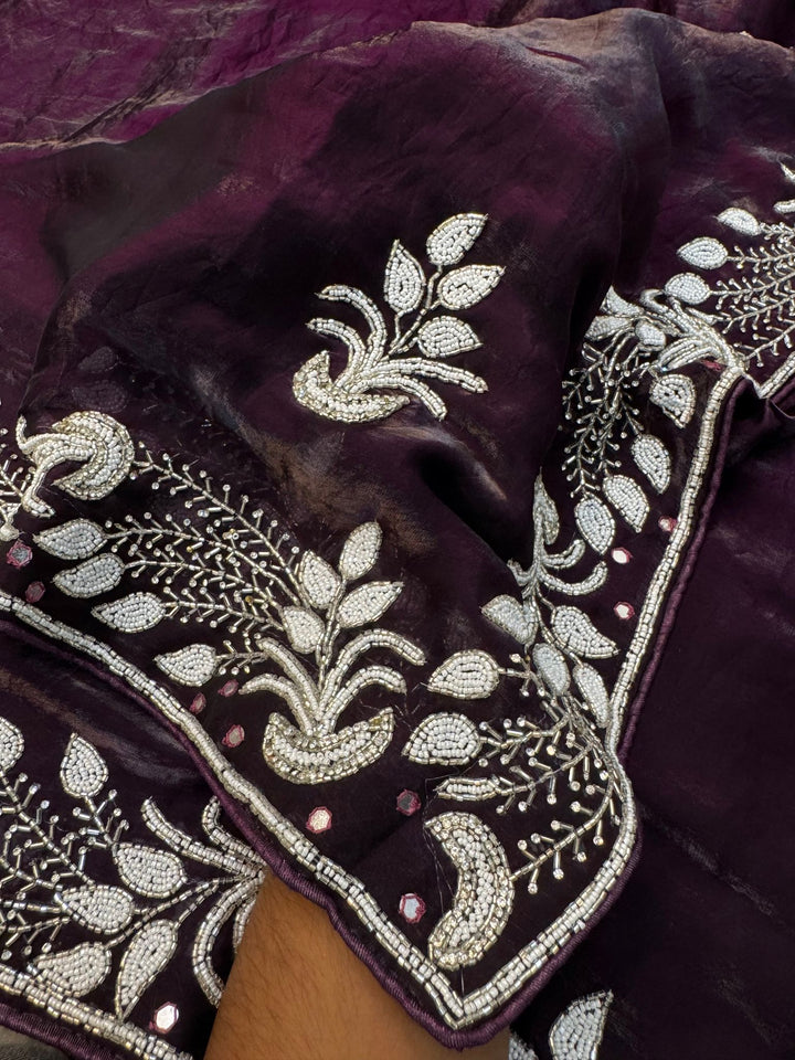 Fendy silk saree in wine color with white pearl and bead embroidery in floral and paisley design
