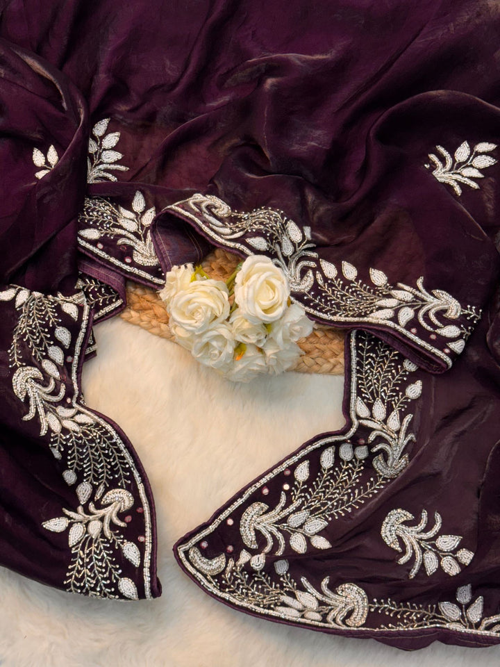 Fendy silk saree in wine color with white pearl and bead embroidery in floral and paisley design