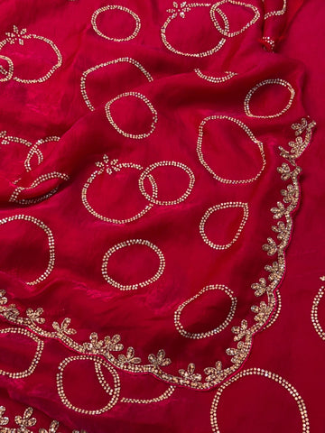 Fendy saree with round gota-style motifs and heavy embroidered floral border

