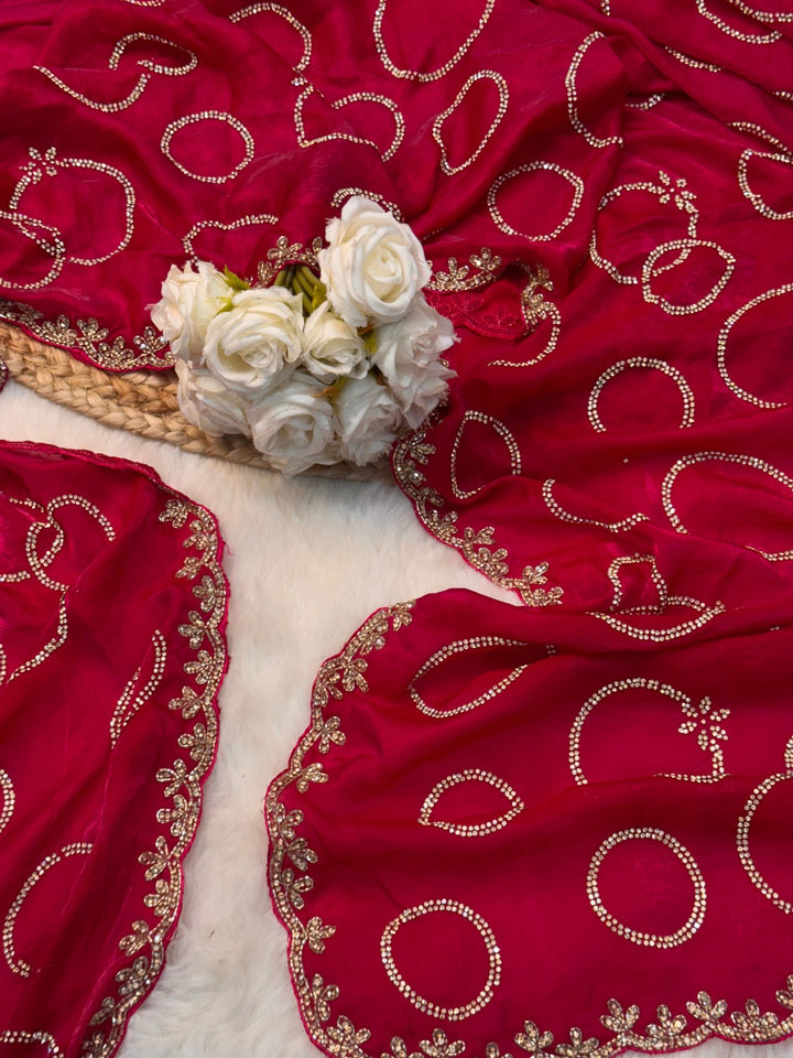 Fendy saree with round gota-style motifs and heavy embroidered floral border

