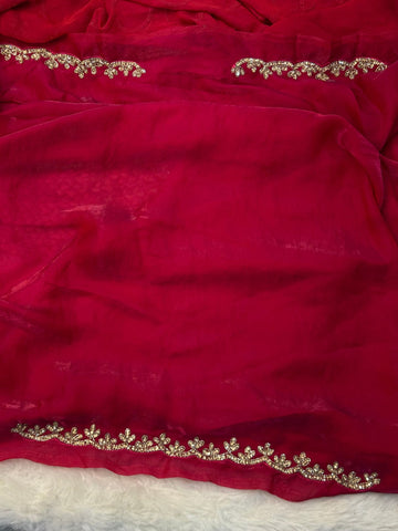 Fendy saree with round gota-style motifs and heavy embroidered floral border

