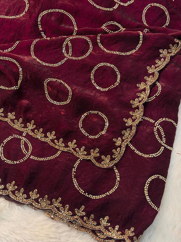 Fendy saree with round gota-style motifs and heavy embroidered floral border

