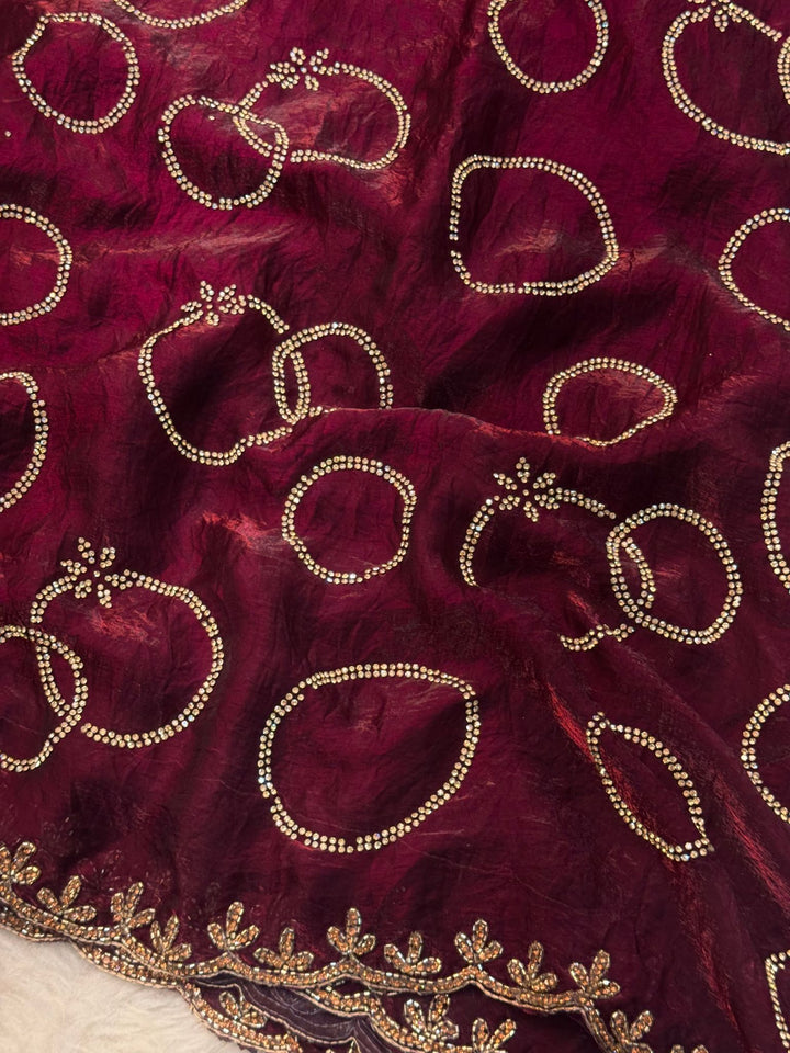 Fendy saree with round gota-style motifs and heavy embroidered floral border

