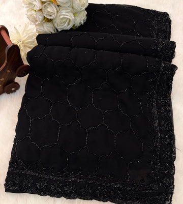 Black georgette saree with all-over cutdana embroidery – folded view