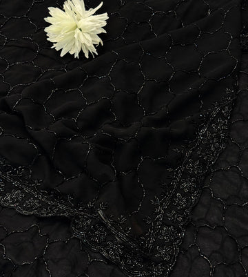Black georgette saree with all-over cutdana embroidery – folded view