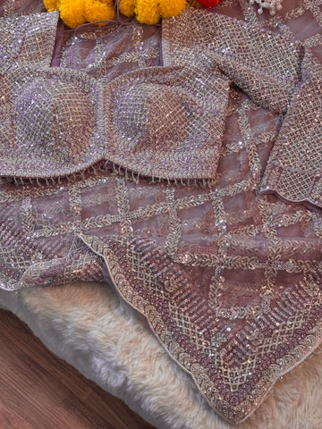 Designer net saree with heavy stitched blouse and sequin embroidery in mauve, pink, and ivory colors