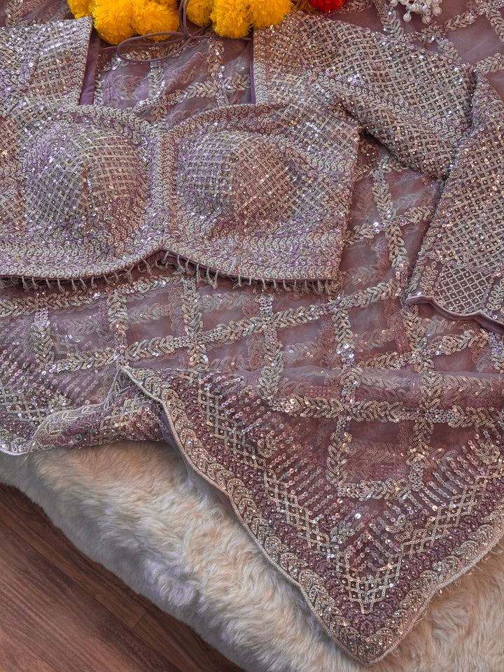 Designer net saree with heavy stitched blouse and sequin embroidery in mauve, pink, and ivory colors