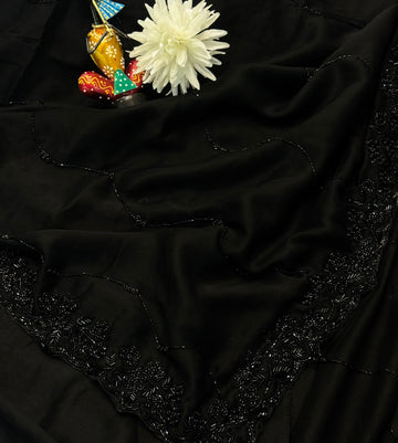 Black Rangoli silk saree with wave-style cutdana embroidery – folded view