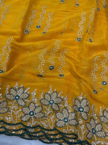 Yellow shimmer chiffon saree with white floral embroidery and green blouse – perfect for haldi and festive wear