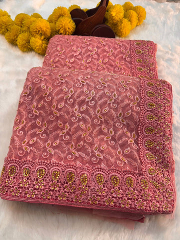 "Elegant net saree with intricate jaal embroidery and embellished border, paired with matching unstitched blouse – perfect for festive and wedding wear