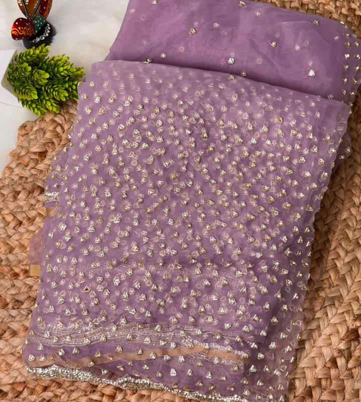 Glass tissue saree with intricate silver samosa handwork and scalloped sequin border, available in elegant pastel and jewel-tone shades