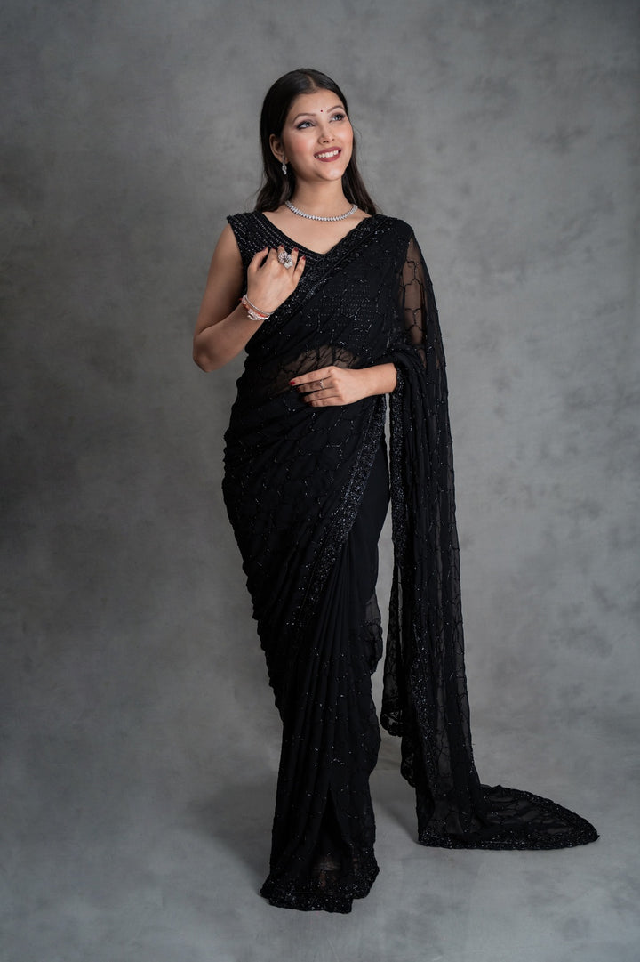 Black georgette saree with all-over cutdana embroidery – folded view