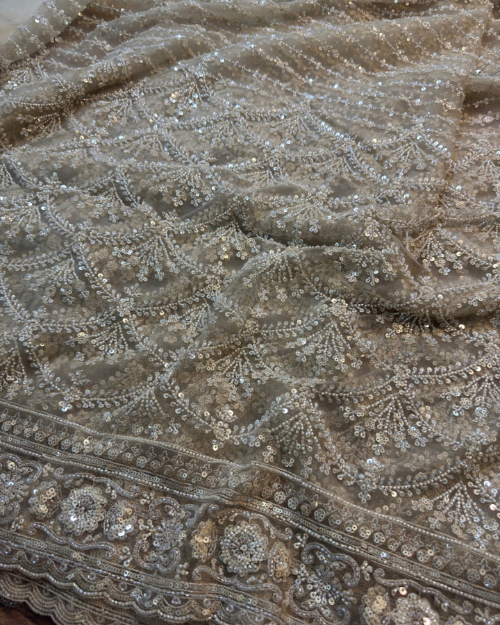Cream Net Saree with Heavy Cutdana & Sequin Embroidery + Designer Embellished Blouse