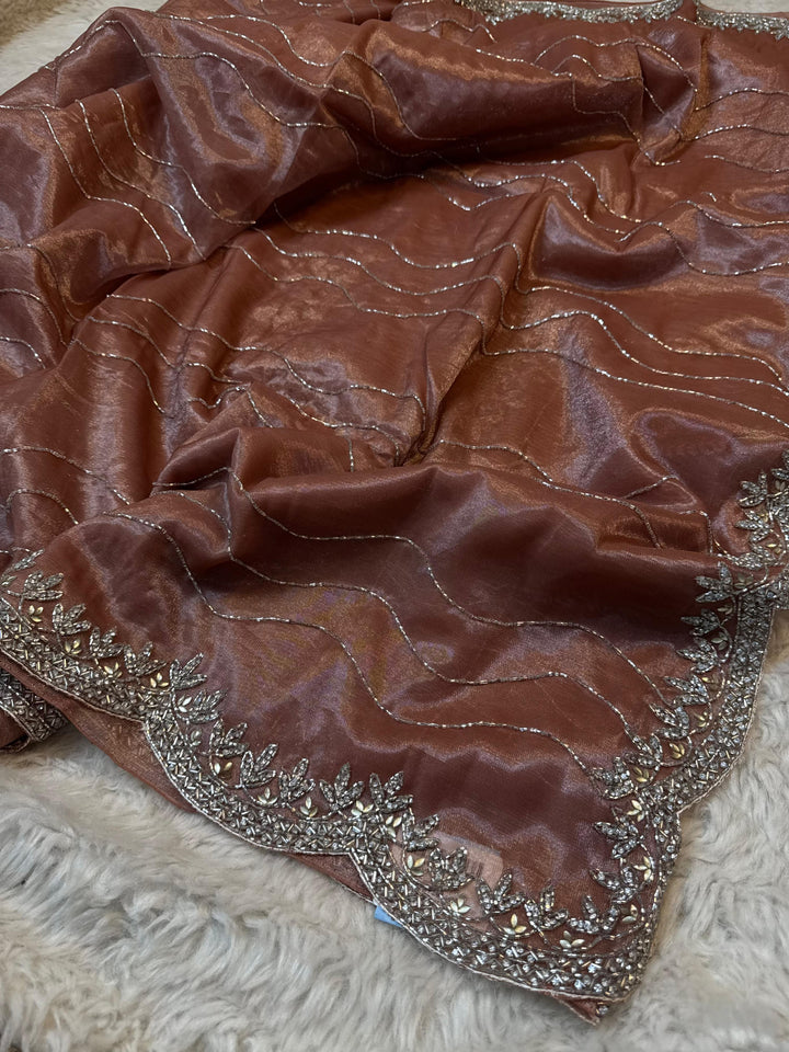 Elegant Tissue Saree with Metallic Waves & Heavy Border