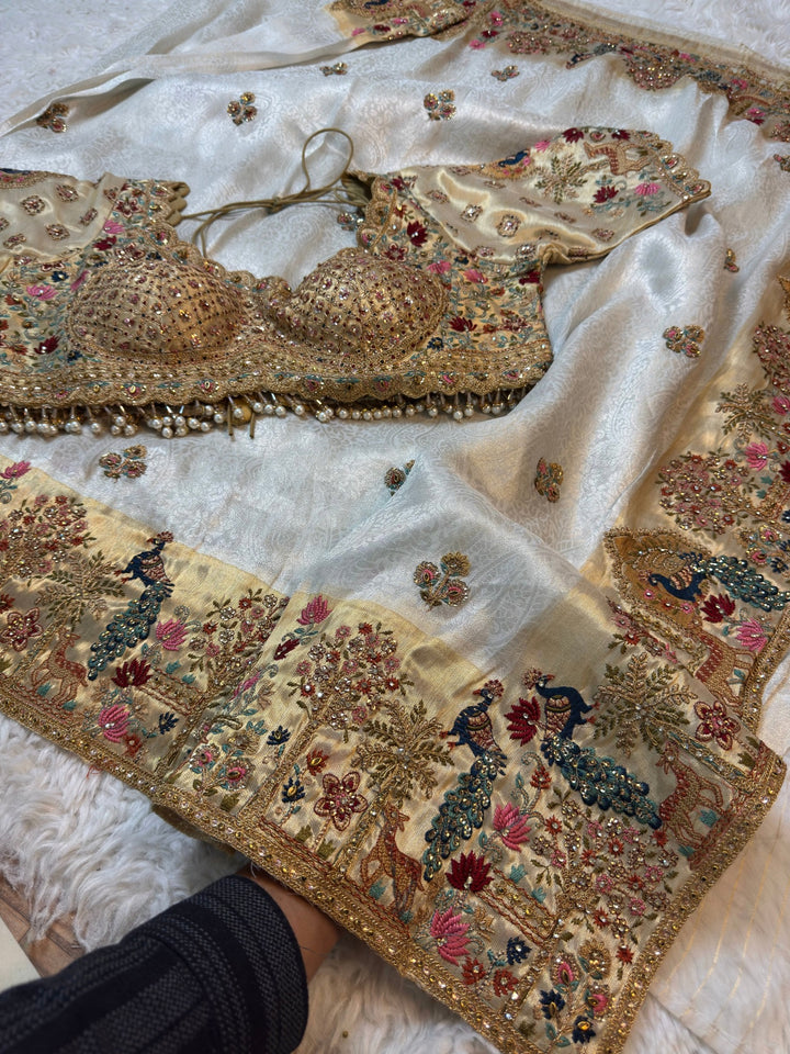 Ivory Jacquard Silk Saree with Royal Peacock & Elephant Embroidered Border (Stitched Blouse)