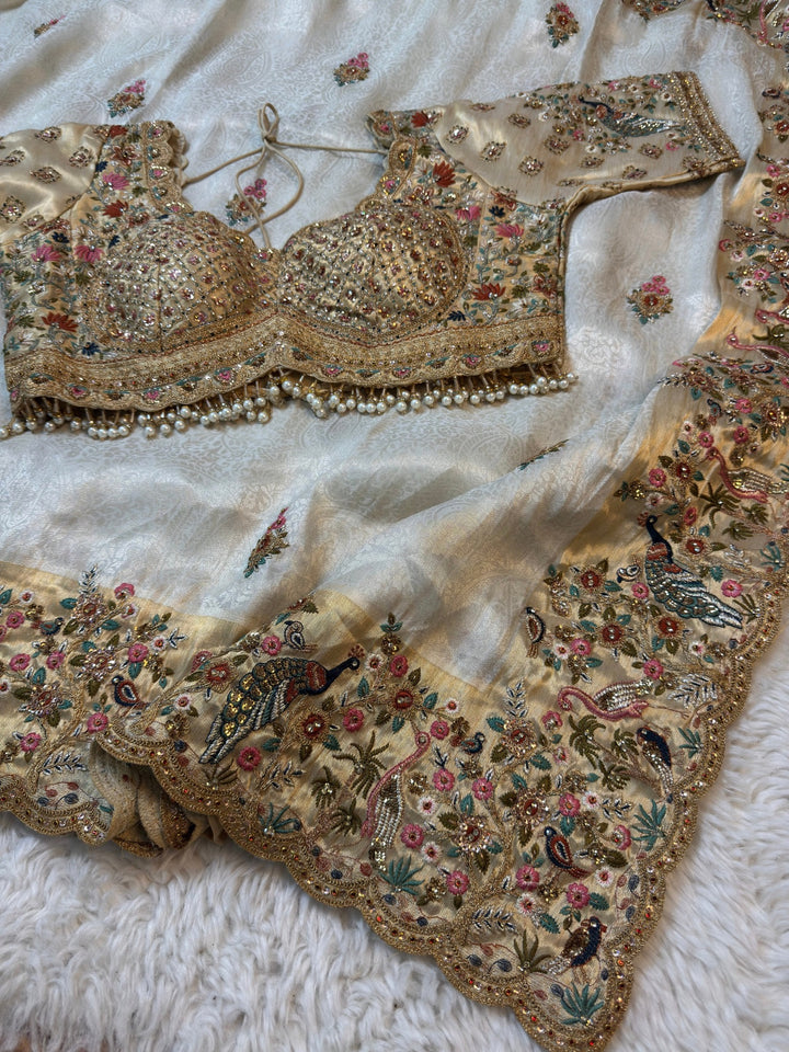Ivory Jacquard Silk Saree with Royal Peacock and bird Embroidered Border (Stitched Blouse)